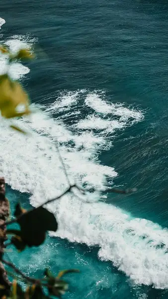Surf against the rocks, from the cliff edge