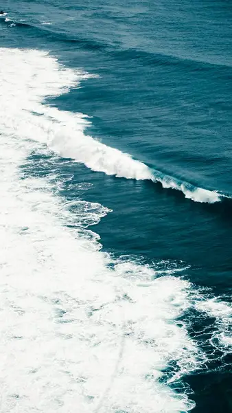 Ocean swell breaking, straight down from the cliff edge