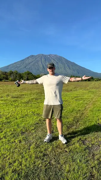 Standing in a field below Mount Agung