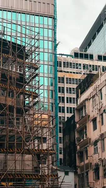 Scaffolding and green netting across a facade