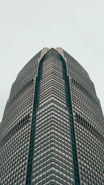 A curved tower facade, straight up from the pavement