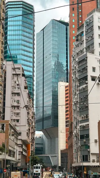Glass towers over a street of shopfronts