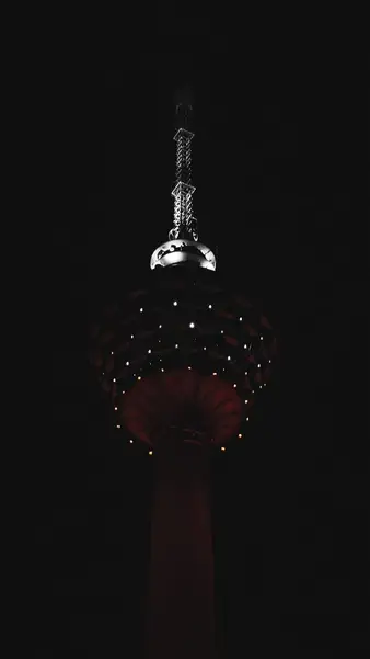 KL Tower lit up above the trees