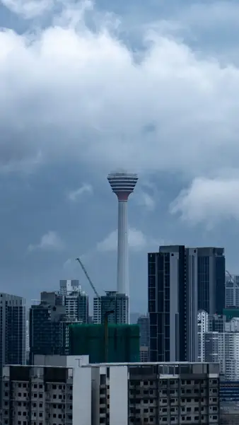 KL Tower against a bank of cloud