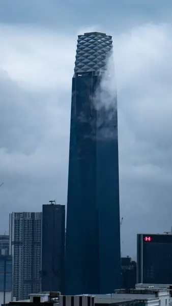 A tower going up into low cloud
