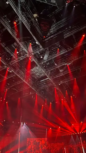 Red beams over an arena stage