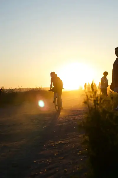 Riding into the sunset on a dirt track