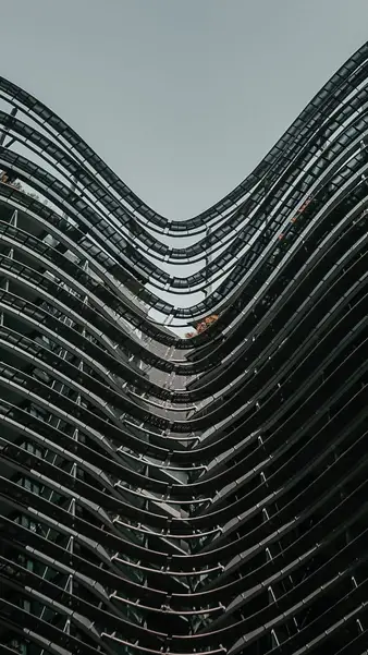 Stacked balconies curving around a residential block