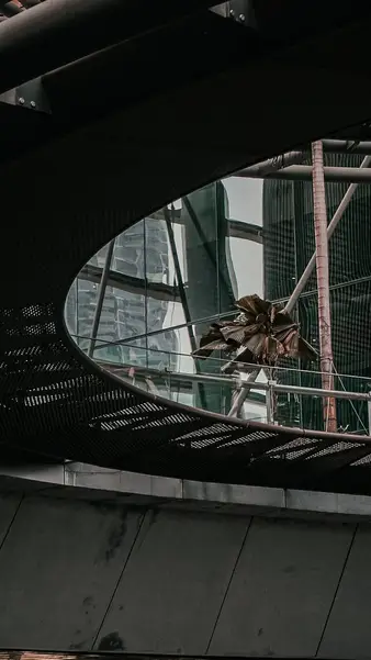 A circular opening in a walkway canopy